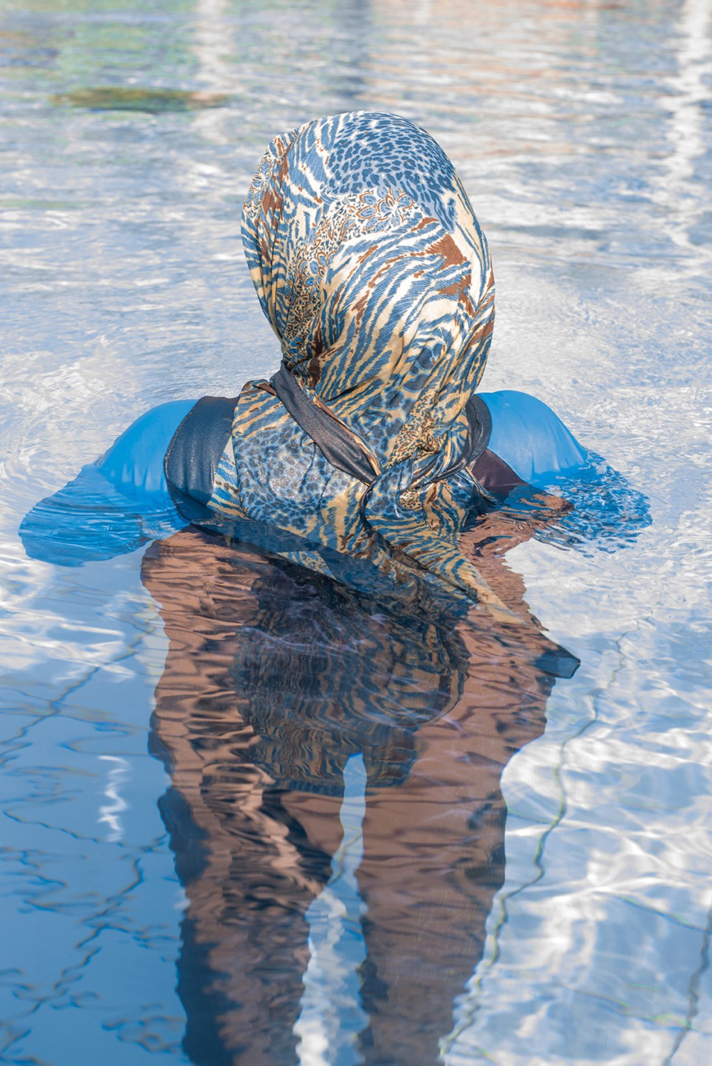 The Photographer Showing Burkinis in Objective, Abstract Light