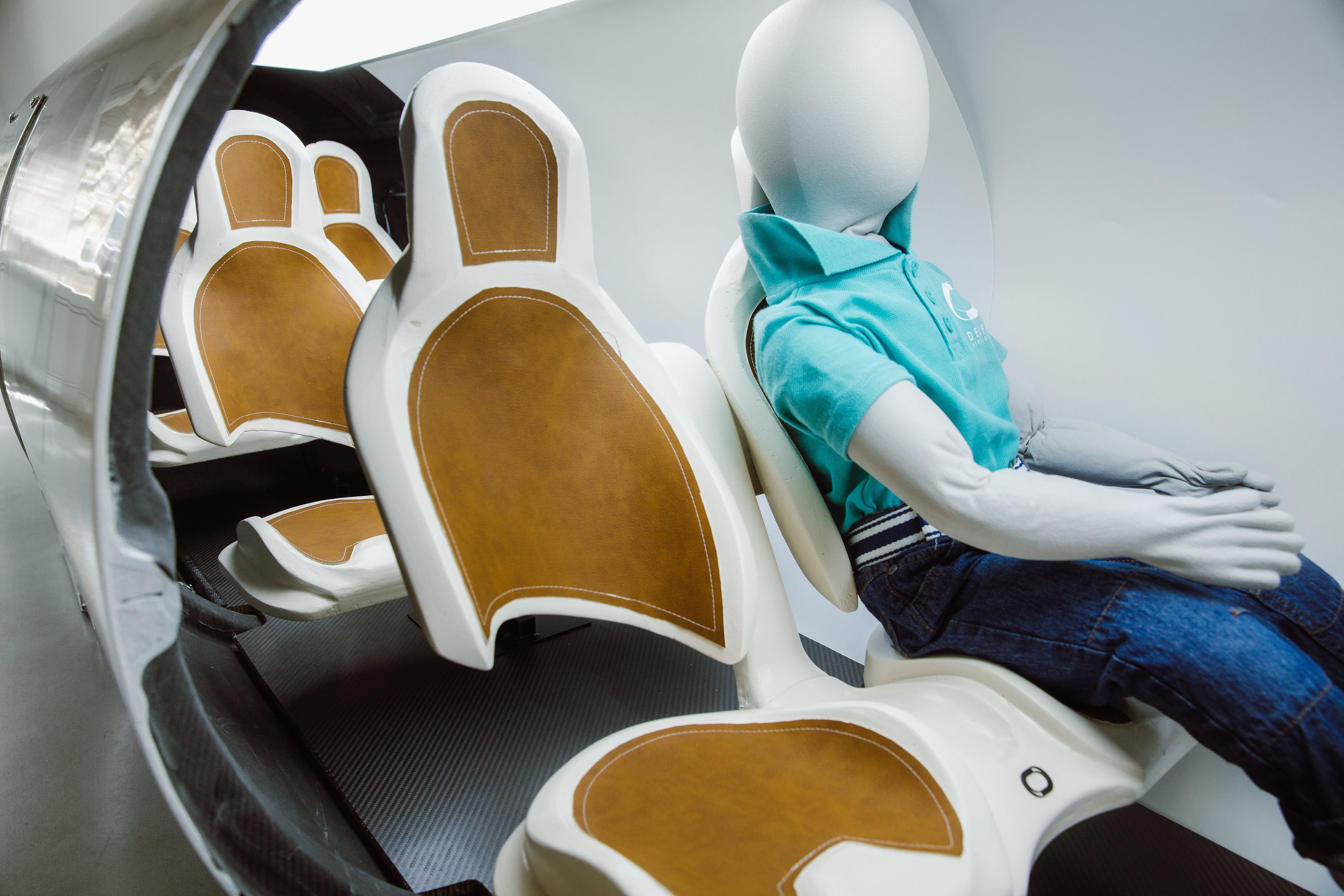 A dummy sits inside the Delft pod prototype. Image: Joost Weddepohl