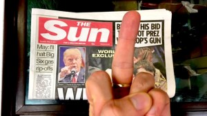 someone sticking their middle finger up at The Sun newspaper