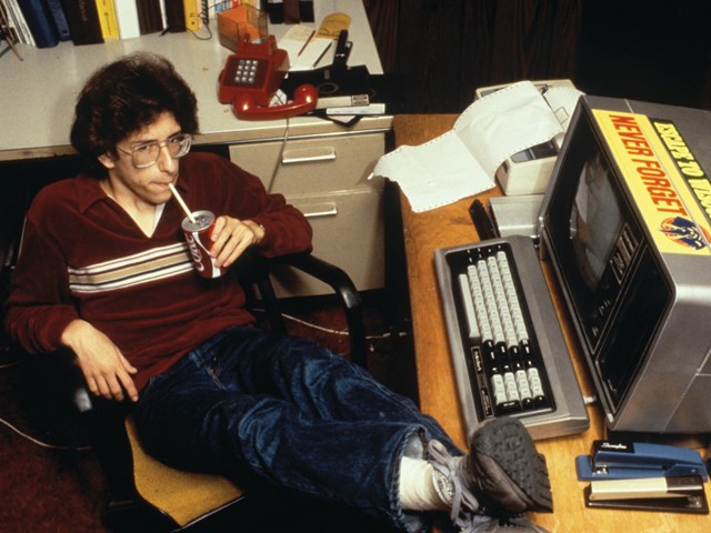 Robert Morris relaxing at his computer drinking a coke