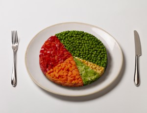 plate with frozen carrots, peas, corn, red peppers