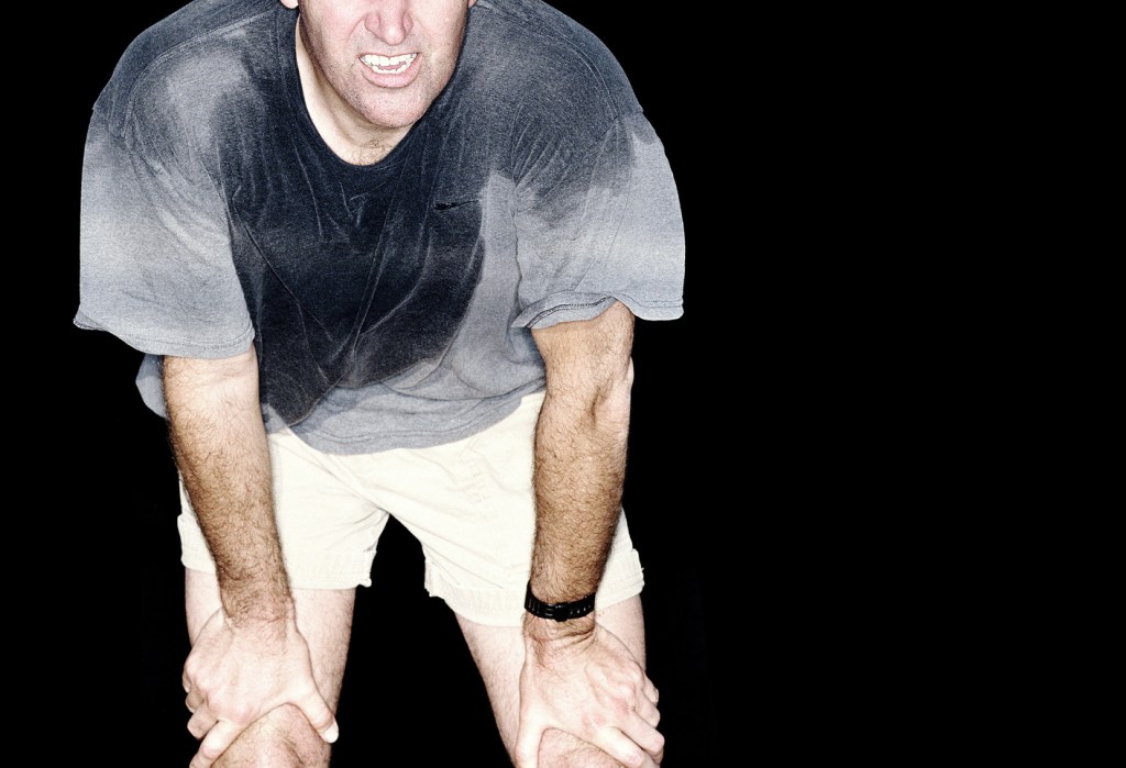 man in sweaty grey t-shirt