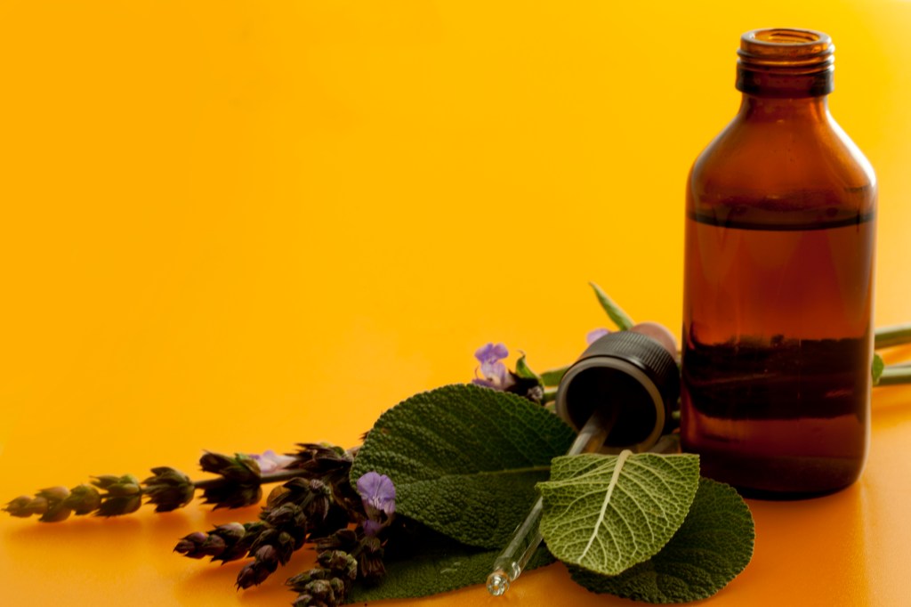 Bottle with herbal plants