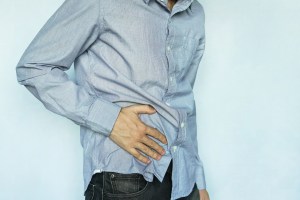 man showing symptoms of appendicitis