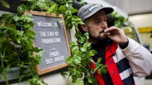 Matthew Macdougall smokes a joint during a "Wake and Bake" legalized marijuana event in Toronto