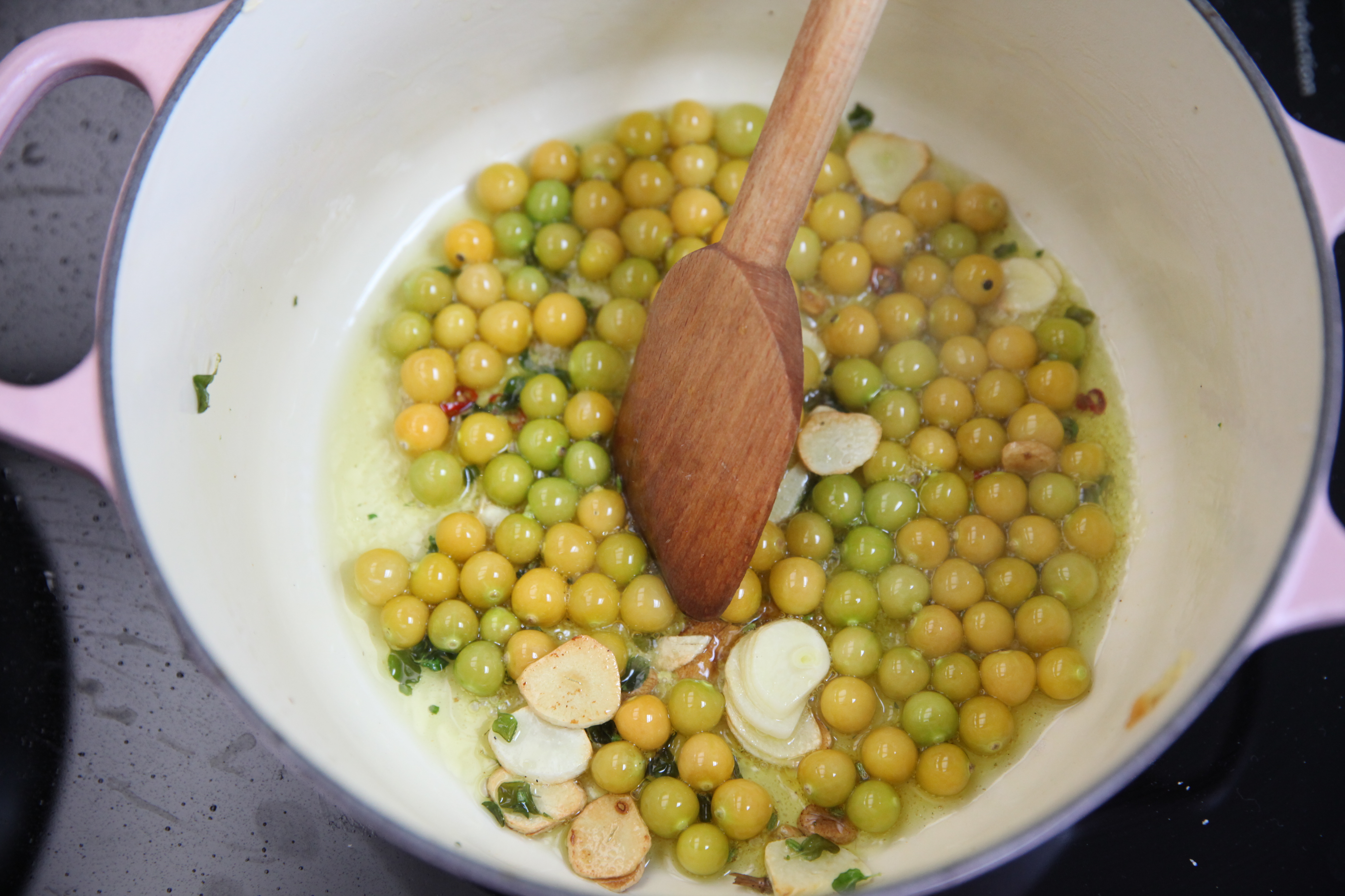 sauteeing husk cherries with garlic