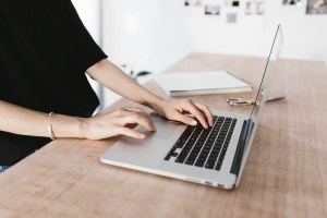 Woman typing on laptop