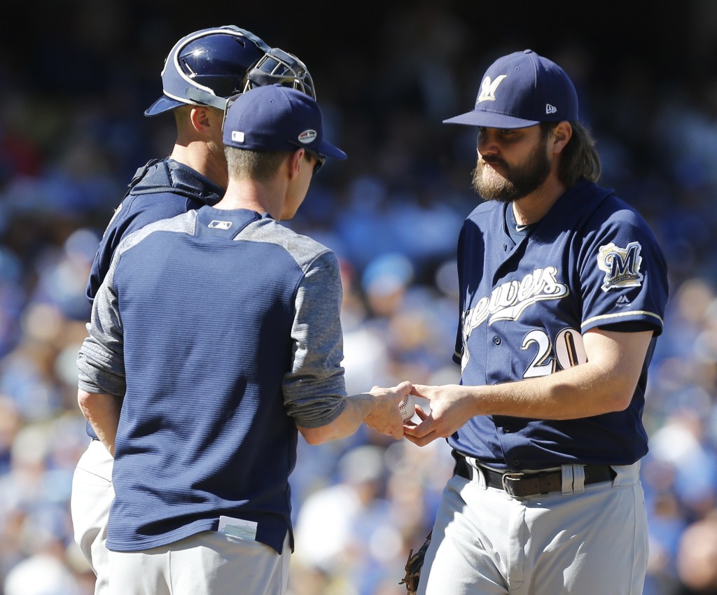 Milwaukee Brewers manager Craig Counsell removes starting pitcher Wade Miley after five pitches.