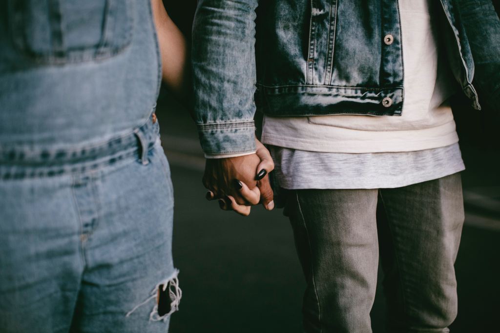 two people holding hands