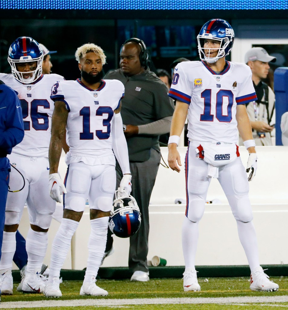 Odell Beckham, Jr., Eli Manning, and Saquon Barkley on the Giants sideline.