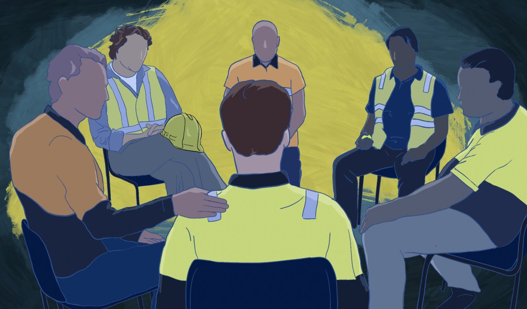 A circle of construction industry workers sit in a therapy setting