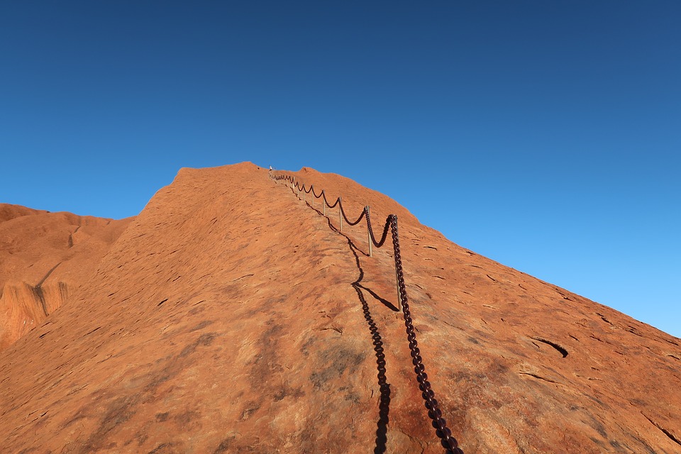 Uluru with a support chain for climbers