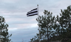 A black and white straight pride flag.