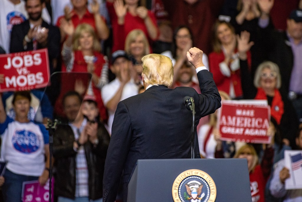 Donald Trump onstage at a rally.