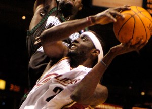 Darius Miles, playing for the Cleveland Cavaliers, drives to the basket against Minnesota Timberwolves' Kevin Garnett.