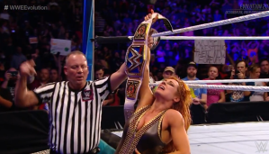 Becky celebrates her win at WWE Evolution.