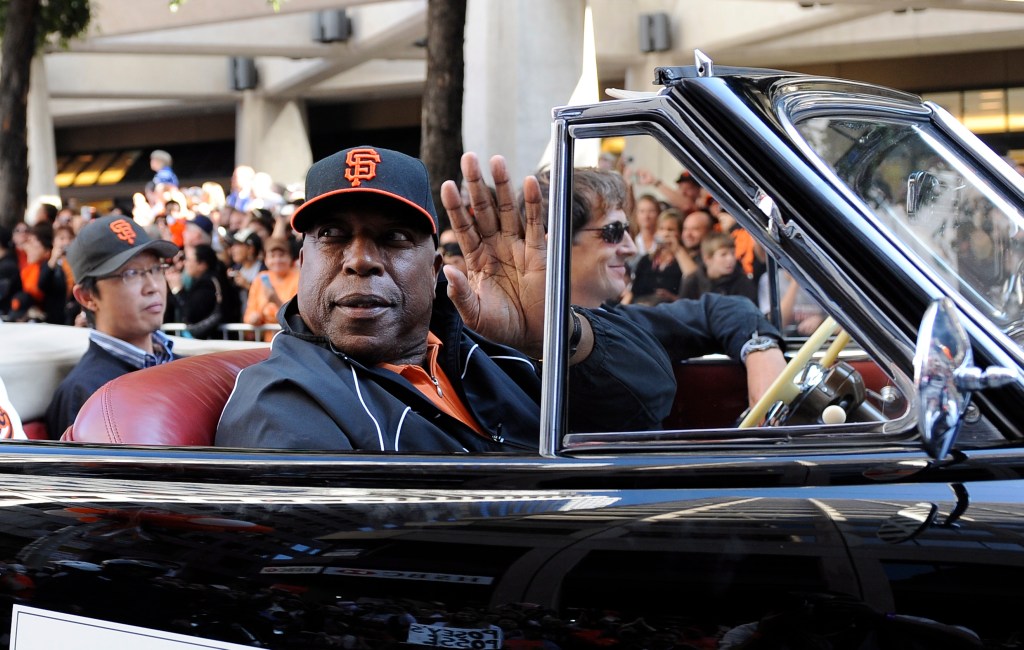 Willie McCovey waves to fans during San Francisco Giants World Series parade.