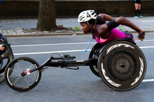 Athlete Michelle Wheeler competing in the wheelchair division of a marathon