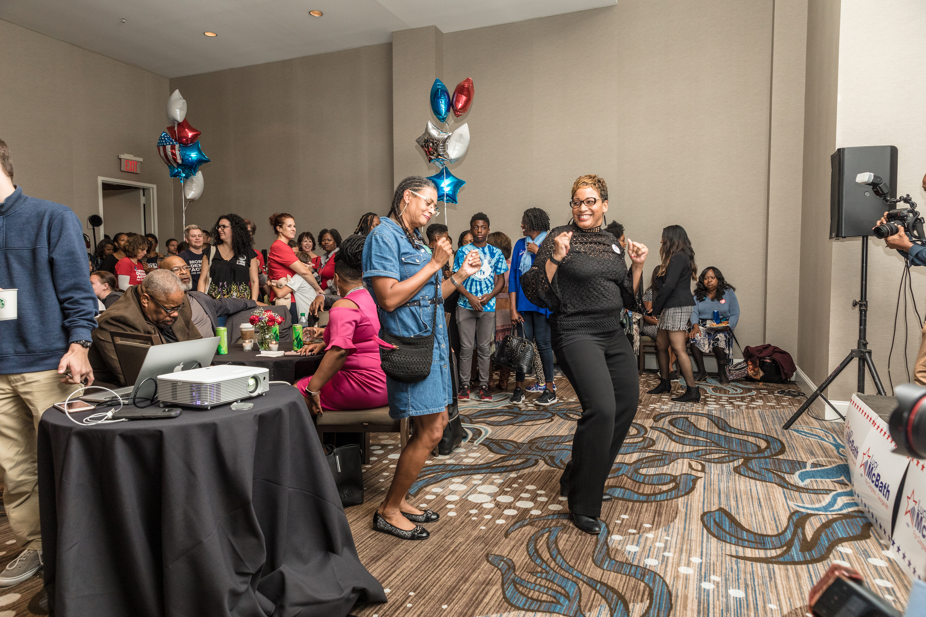 Two women broke out into dance at McBath's election results party Tuesday night.