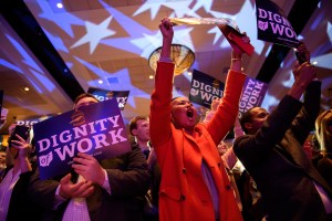 Democratic supporters cheer at a rally.