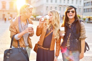 Women drinking take-out coffee