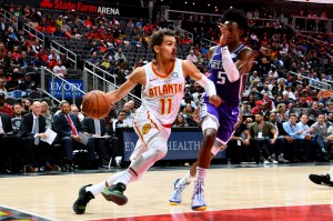 Trae Young drives the baseline against the Sacramento Kings