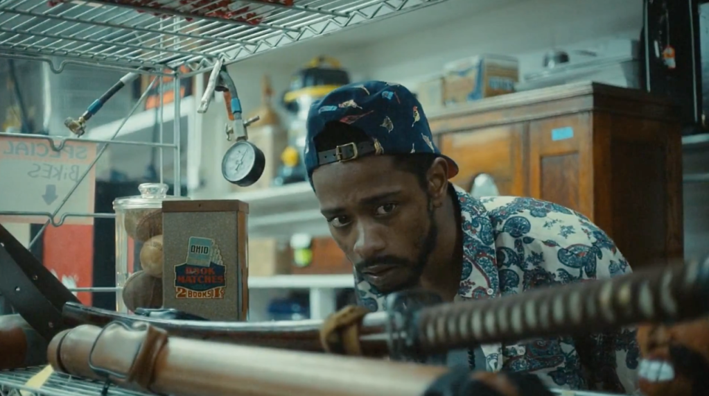 Darius (Lakeith Stanfield) from 'Atlanta' looks at a samurai sword in a pawn shop.