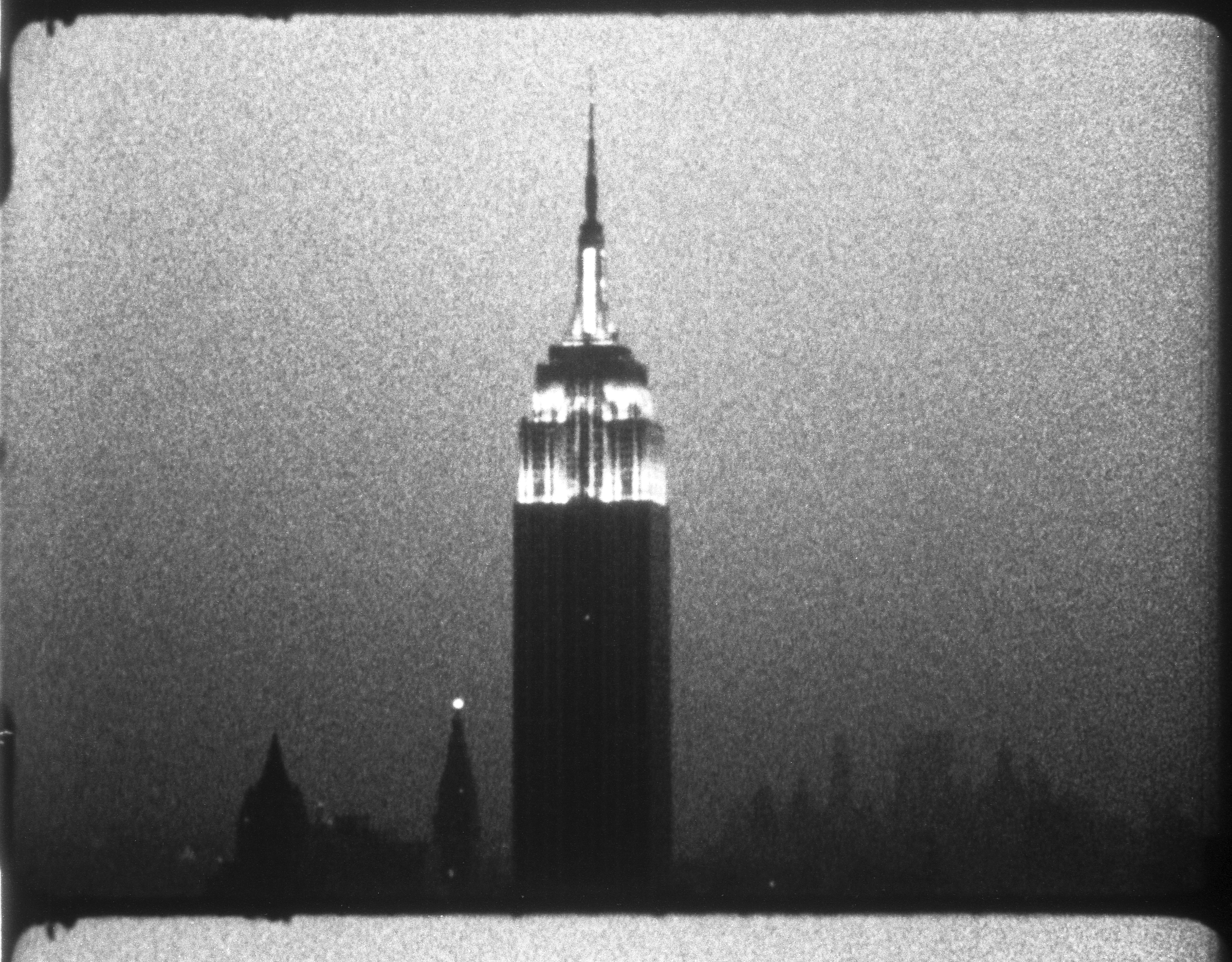 Andy Warhol (1928–1987), Empire, 1964. 16mm, b&w, silent; 8 hrs., 5 min. at 16 fps, 7 hrs., 11 min. at 18 fps © 2018 The Andy Warhol Museum, Pittsburgh, PA, a museum of Carnegie Institute. All rights reserved.