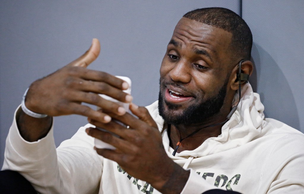 LeBron James looking at his phone before practice at the Warriors practice court during the 2017 NBA Finals.