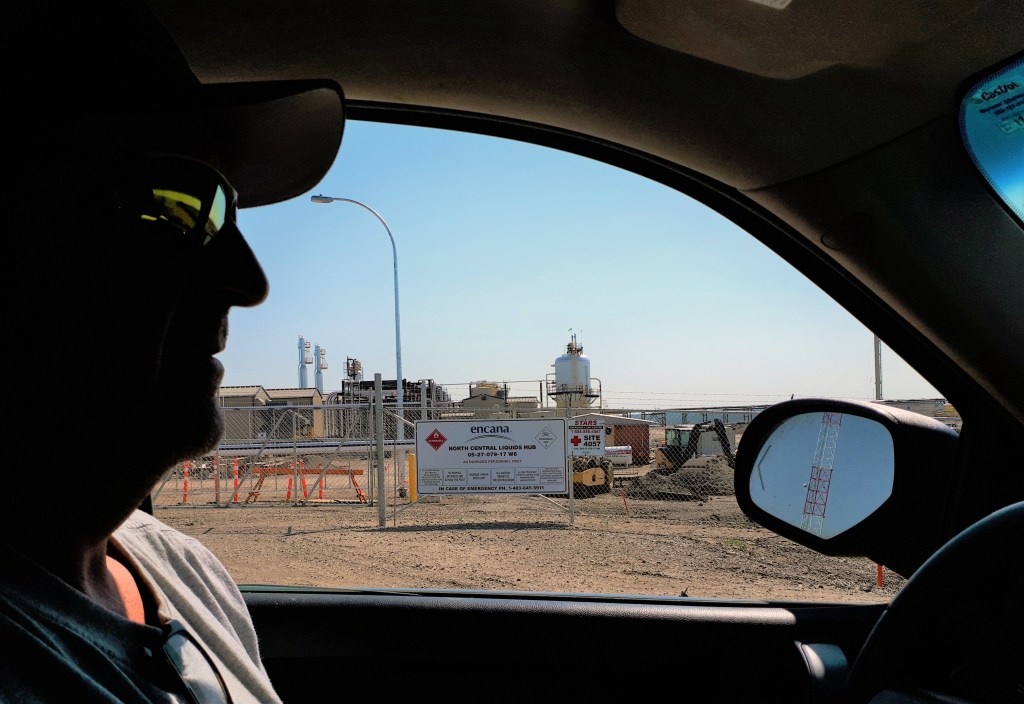 Jim Strasky driving past Encana site.