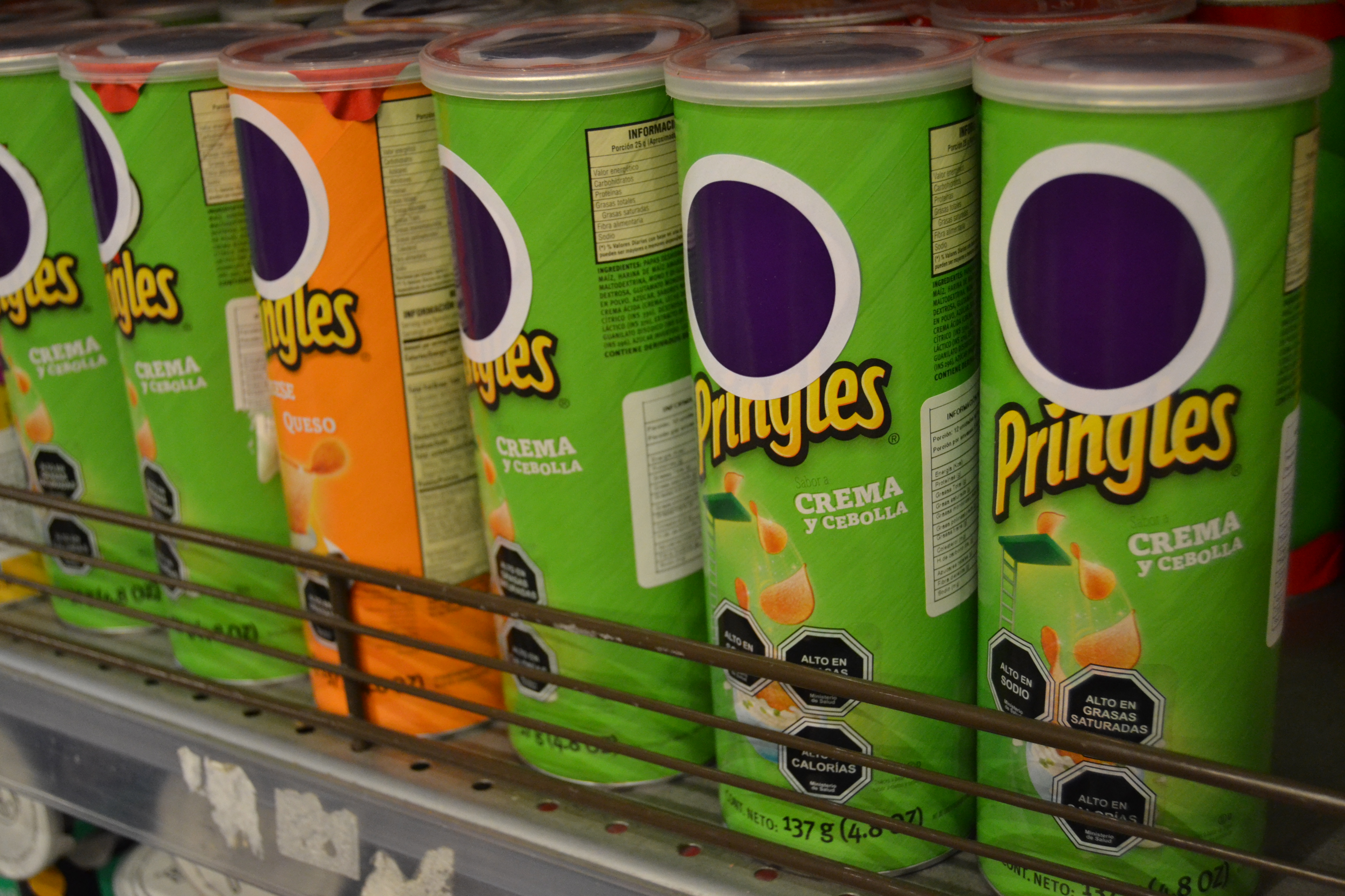 Pringles cans that don't have the iconic smiling face.