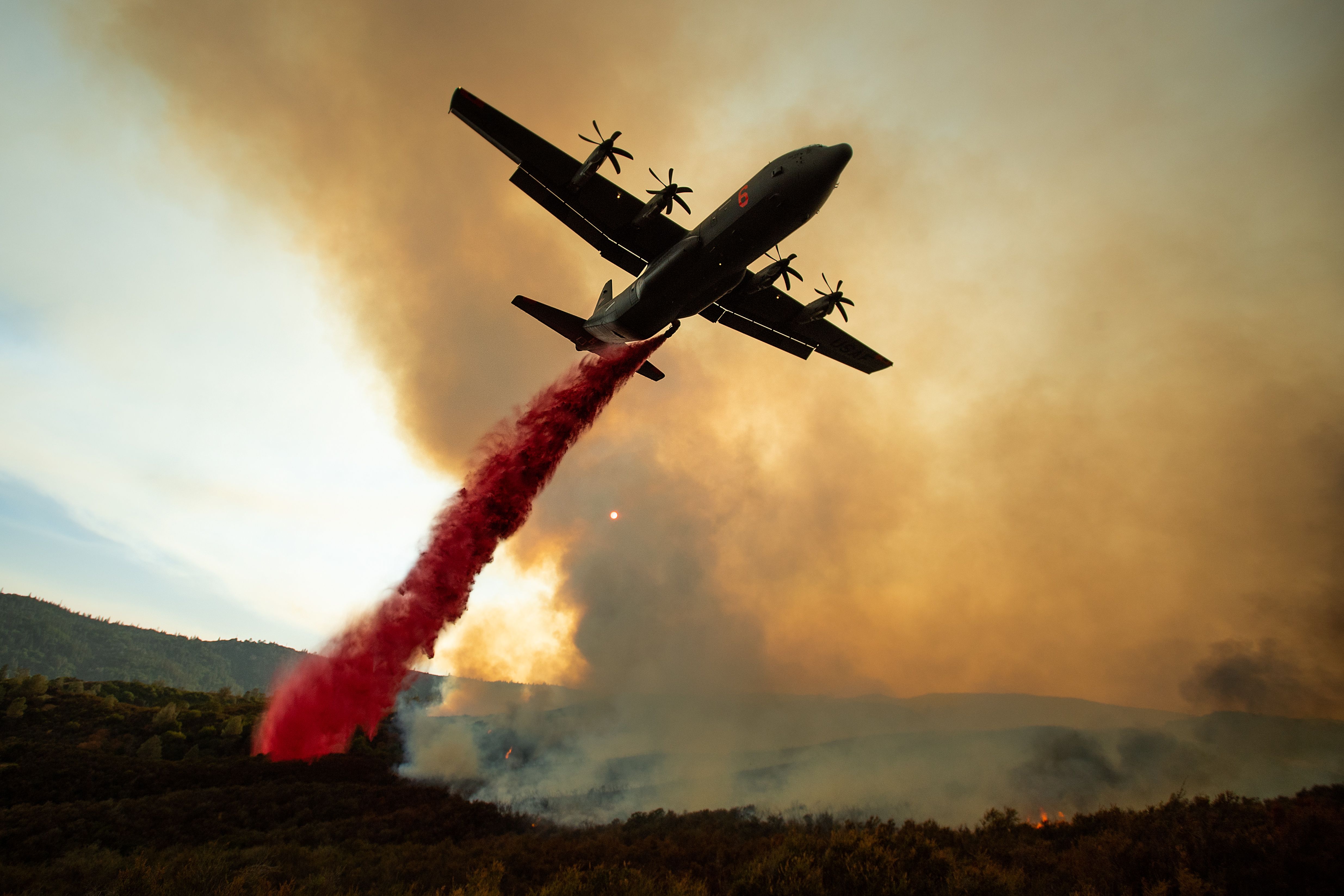 Air air tanker dropping retardant on part of the Mendocino Complex Fire.