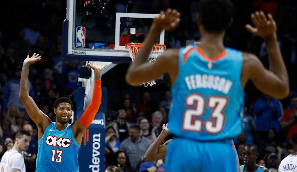 Oklahoma City Thunder guard Paul George celebrates with Terrance Ferguson