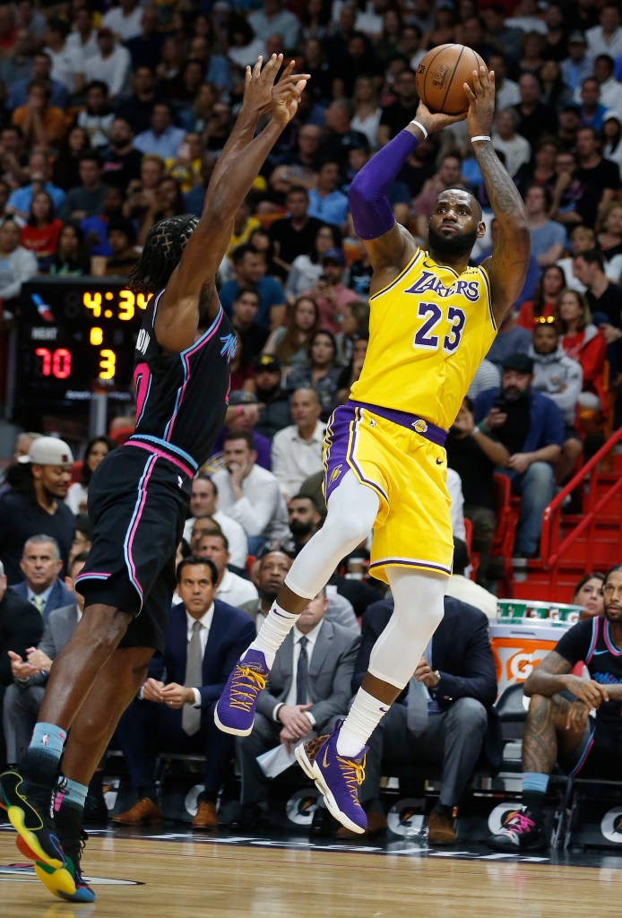 LeBron James hits a fadeaway jumper against the Miami Heat.