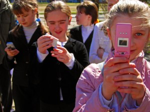 Kids with 90s-era cell phones