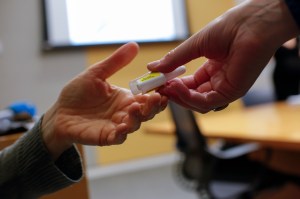 person handing Narcan, naloxone