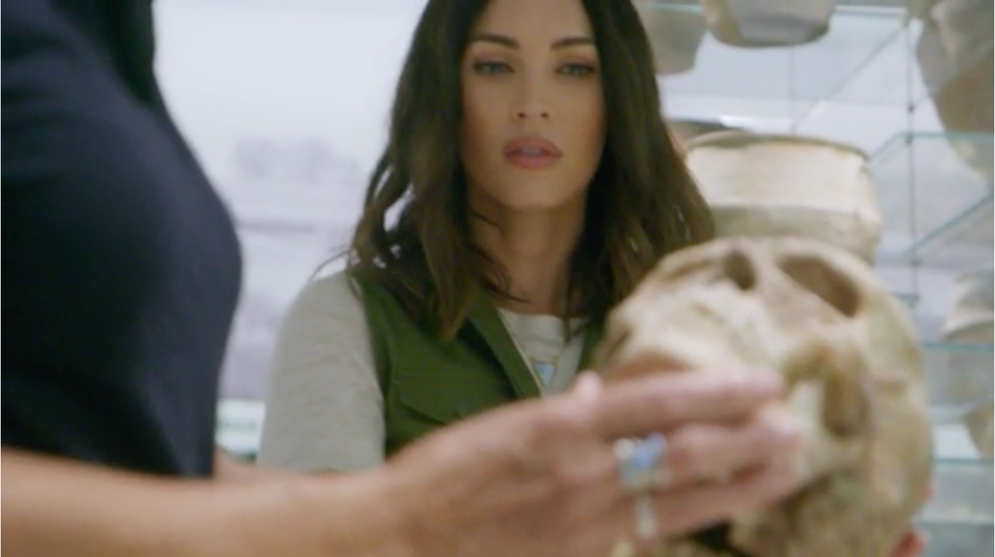 Megan Fox examining a skull