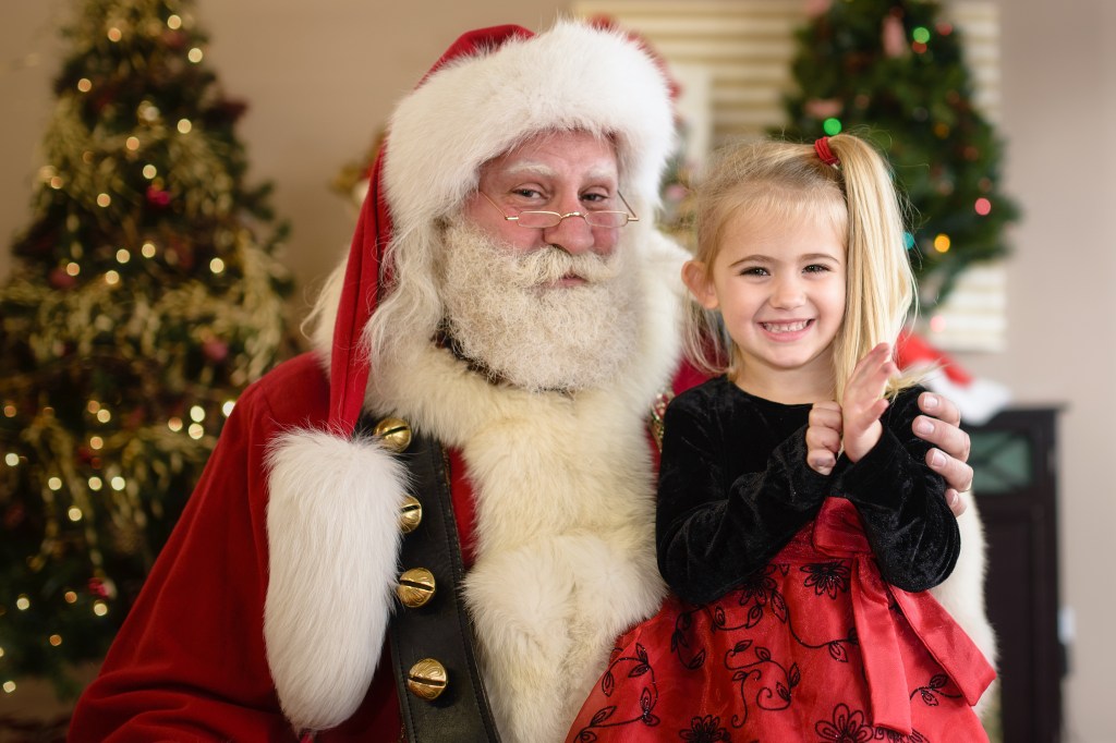 Santa father christmas with little girl