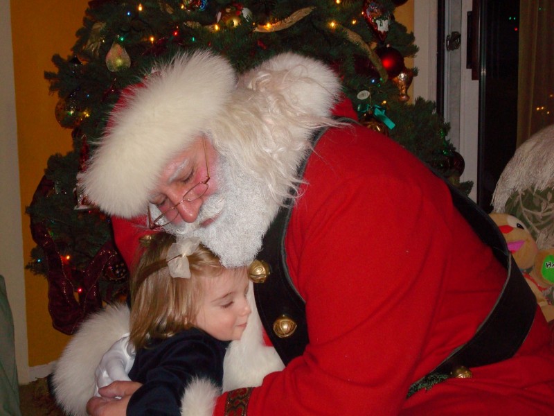 santa father christmas hug little girl