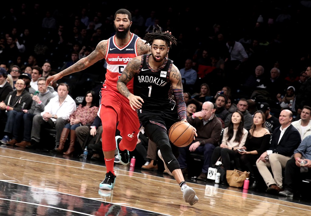 D'Angelo Russell drives past Markieff Morris.