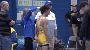 High School wrestler Andrew Johnson getting his dreadlocks cut.