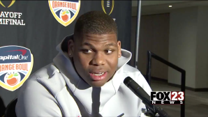 Alabama player Quinnen Williams pauses mid-sentence while talking about Oklahoma QB Kyler Murray.