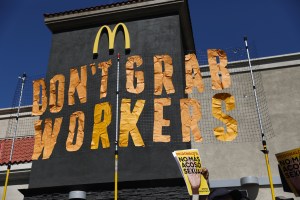 "DON'T GRAB WORKERS" protest sign in front of McDonald's