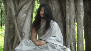 Ram Bahadur Bomjan meditating under a tree