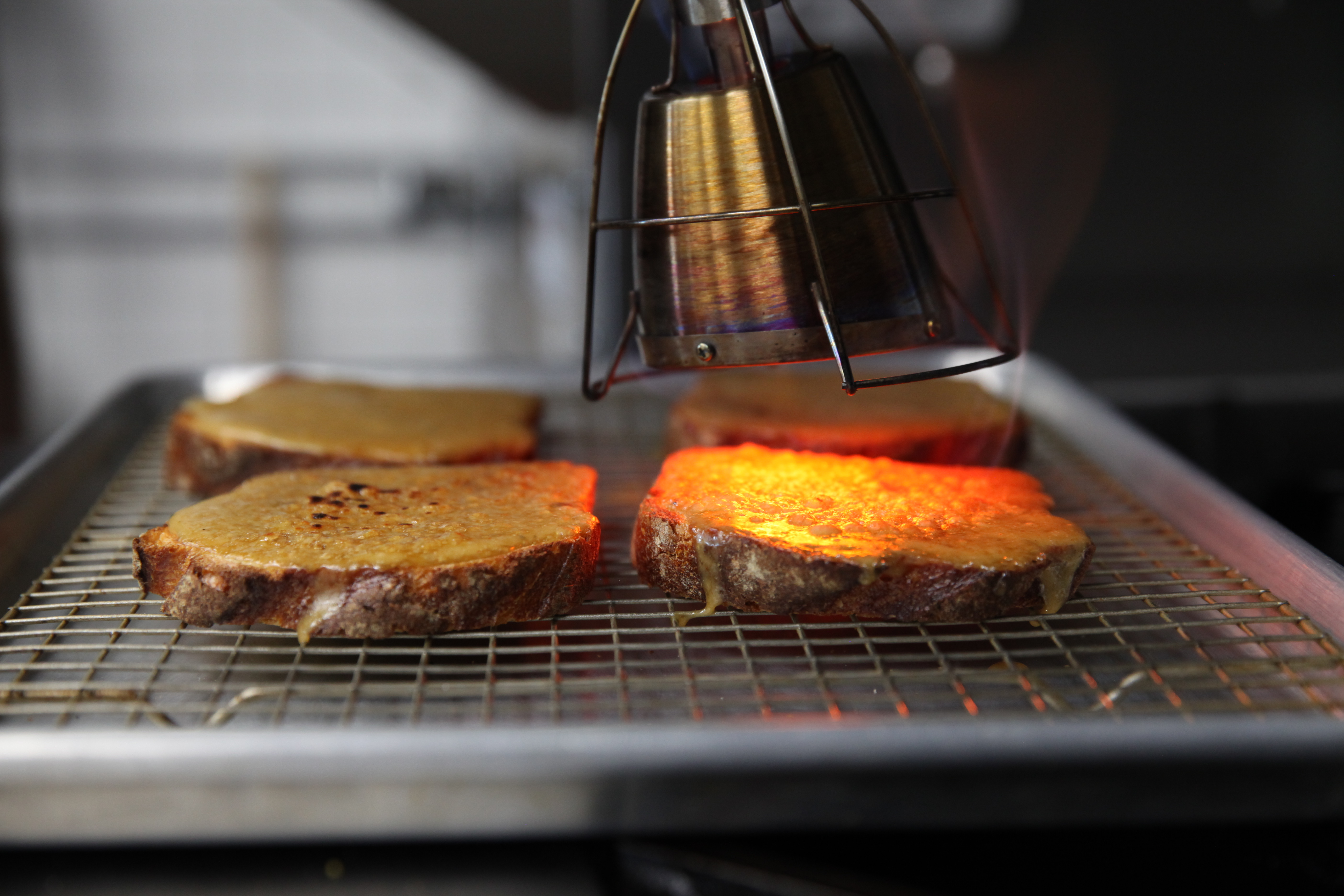 welsh rarebit toasting underneath searzall torch