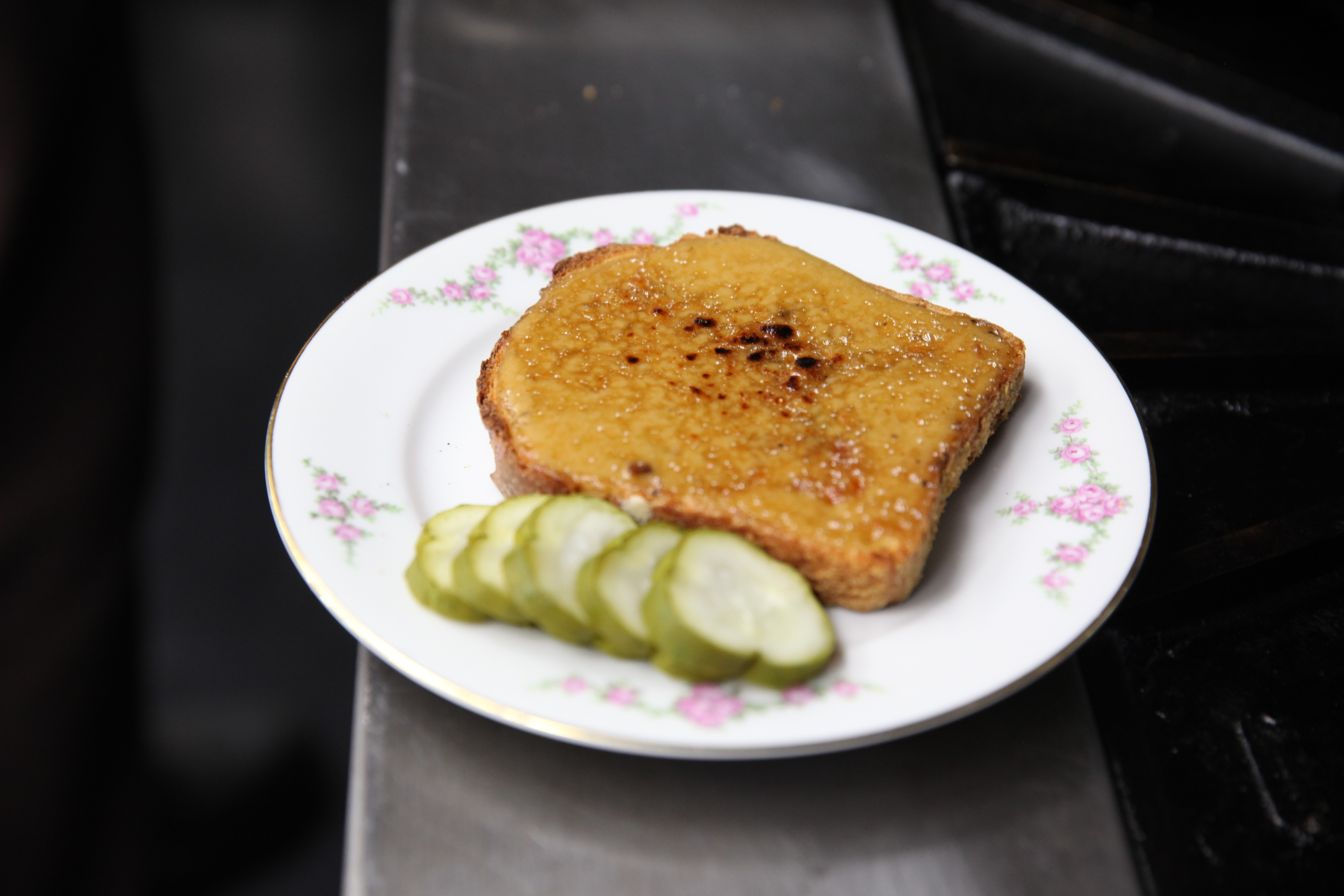 a plate of welsh rarebit and pickles