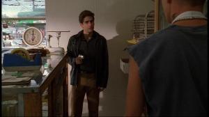 Christopher from The Sopranos holds a gun in the bakery scene from Season 1, Episode 8