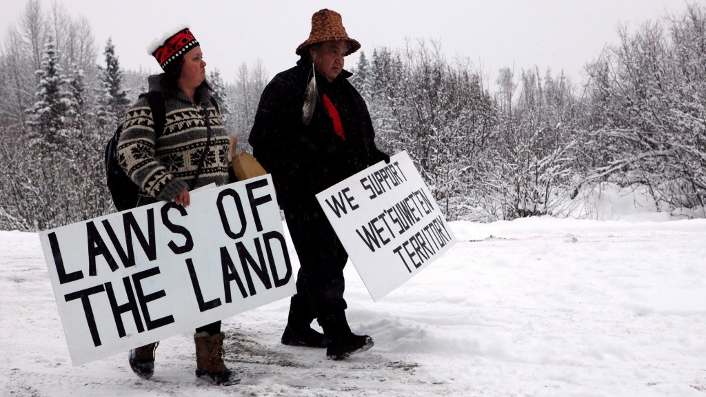 Todd Nelson and Christy Brown from the Nisga'a Nation arrive in support of the Unist'ot'en camp and Wet'suwet'en First Nation gather at a camp fire off a logging road near Houston, B.C, VICE, RCMP