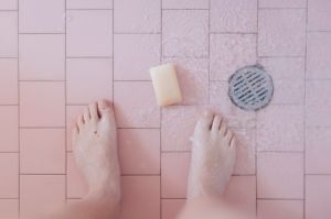 a bar of soap on the floor of the shower