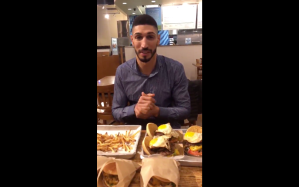 New York Knicks center Enes Kanter eating seven burgers.